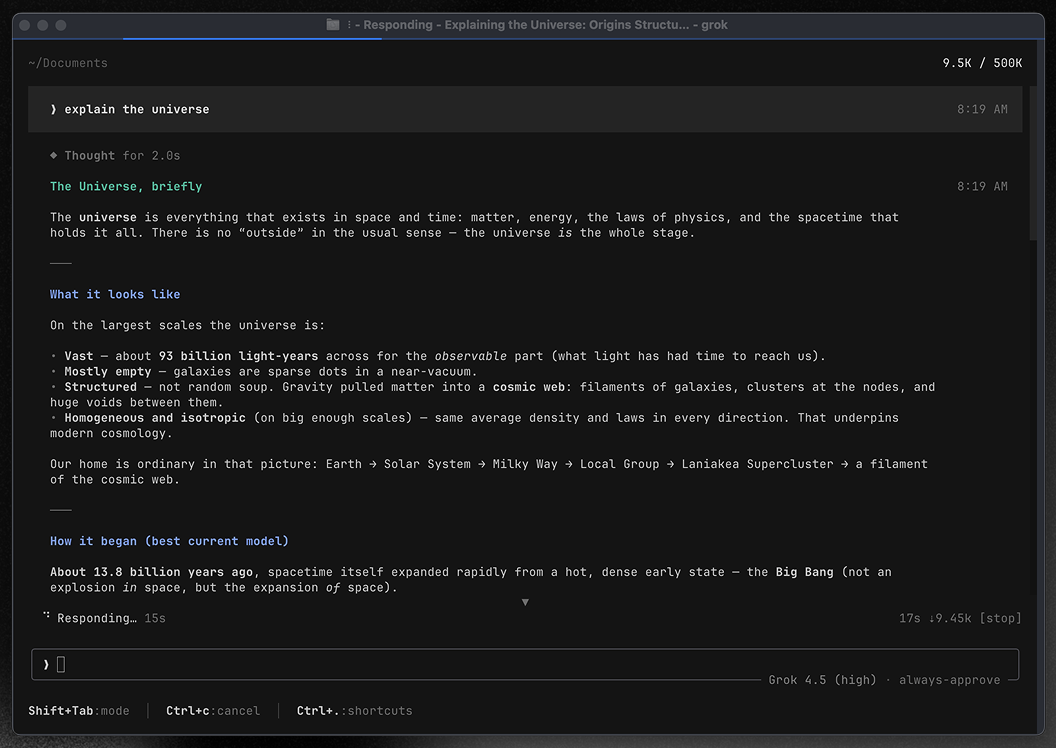 O Grok Build aberto em tela cheia no terminal: o pedido “explain the universe” em cima, a resposta com títulos e listas no meio e, embaixo, a caixa de digitar com o modelo e o modo de aprovação
